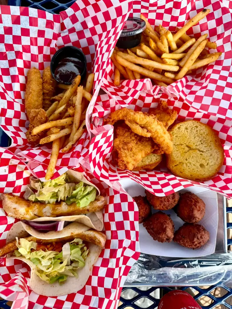 Fish tacos, fried fish sandwich, kids chicken tenders and hush puppies